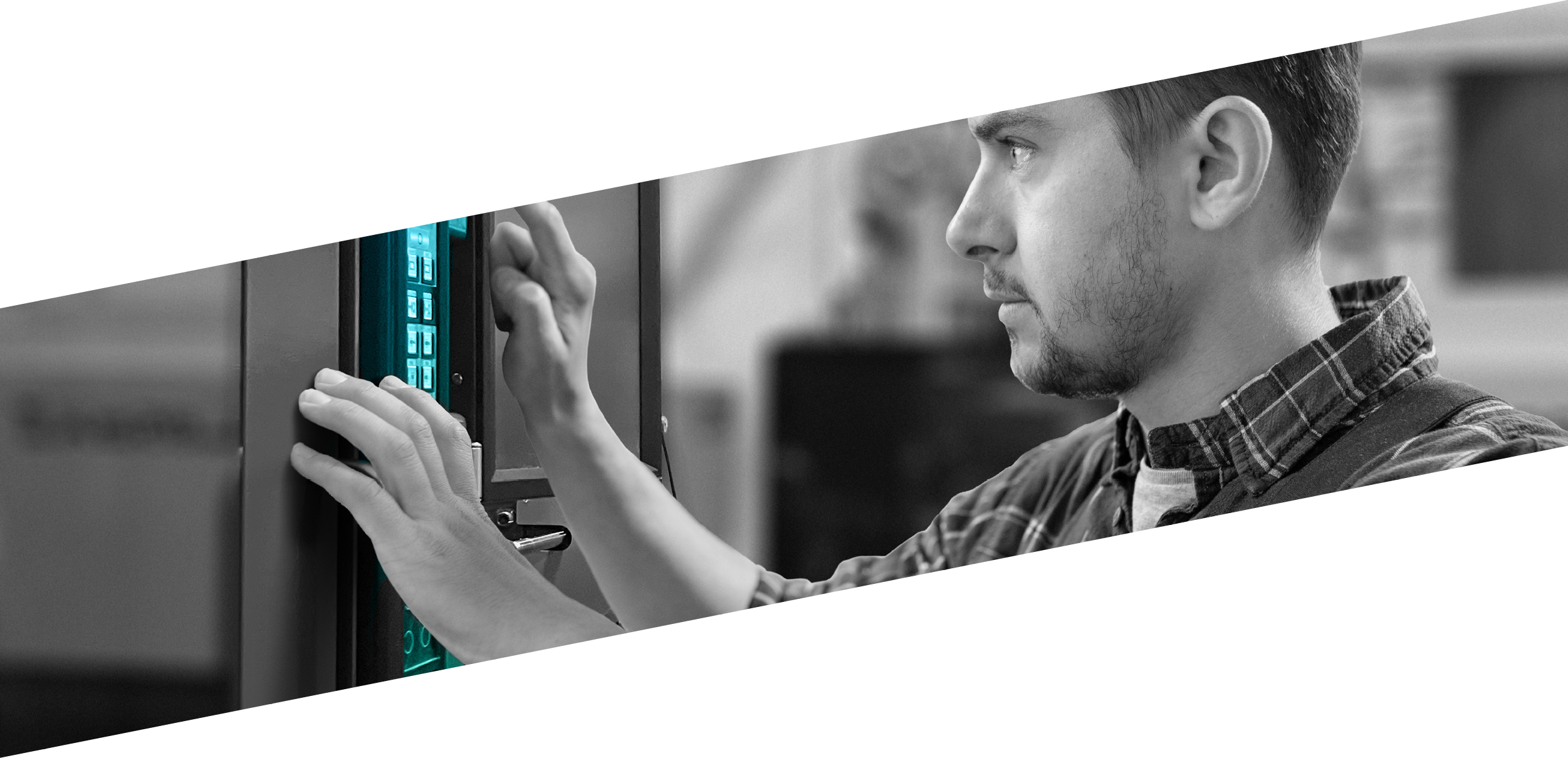 Young serious worker standing in front of control panel while choosing parameters of raw thermoplastic material processing